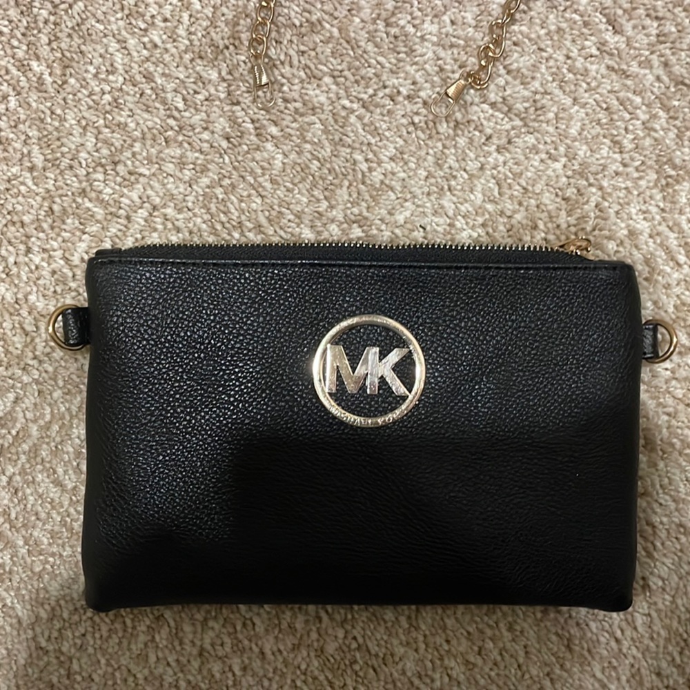 Michael Kors’ clutch purse with detachable strap.